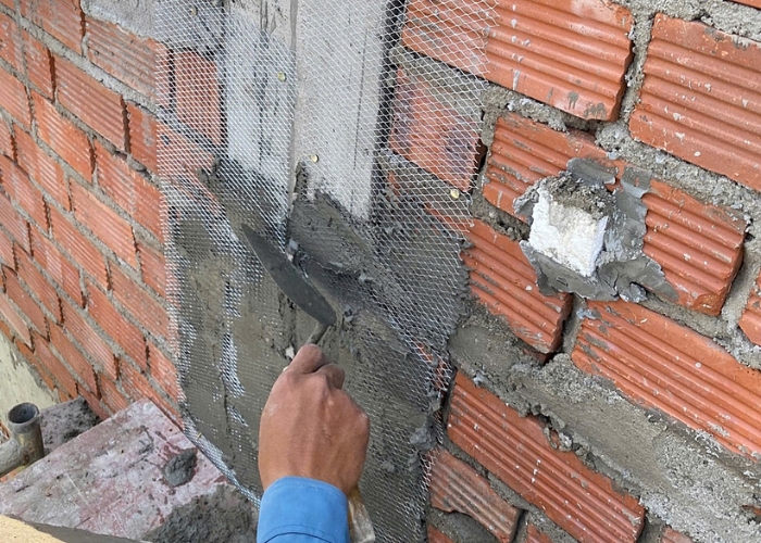 Đặt lưới th&eacute;p chống nứt tại c&aacute;c vị tr&iacute; giao tường